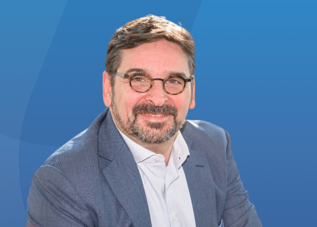 Ronny Lommelen ManpowerGroup BeLux Blue Background e1765301217915