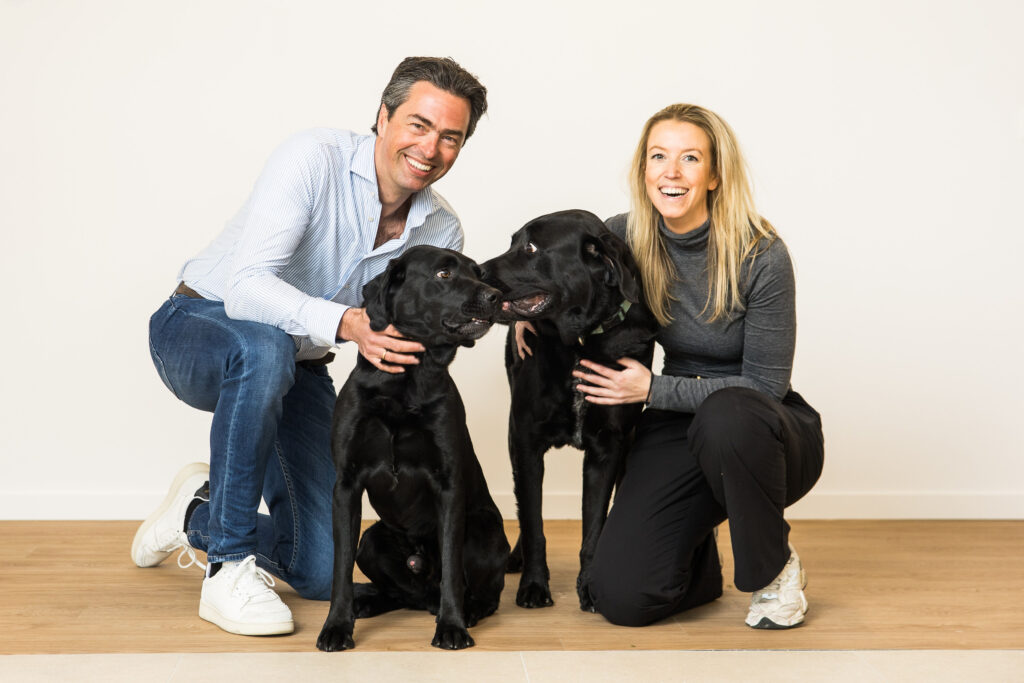 Caspar Kam GM and Josine Jansen CFO of Pet Nutrition Benelux with their dogs in the office